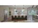 Bright kitchen showcasing a large island with seating, stainless steel appliances, and custom cabinetry at 913 Tyrrell Rd, Raleigh, NC 27609