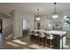 Bright kitchen showcasing a large island with seating, stainless steel appliances, and custom cabinetry at 913 Tyrrell Rd, Raleigh, NC 27609
