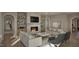 Cozy living room featuring built-in shelving, a fireplace, and comfortable seating for relaxation and enjoyment at 913 Tyrrell Rd, Raleigh, NC 27609