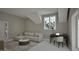 Living room with a work-from-home setup, a plush couch, and a view of the backyard at 913 Tyrrell Rd, Raleigh, NC 27609