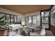 Cozy screened-in porch with ample seating, a perfect blend of indoor comfort and outdoor views at 913 Tyrrell Rd, Raleigh, NC 27609