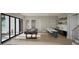 A recreation room with a pool table, bar with seating, and sliding glass doors to the outside at 913 Tyrrell Rd, Raleigh, NC 27609