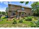 Backyard with a patio, vegetable garden, and a lawn at 10205 Sorrills Creek Ln, Raleigh, NC 27614