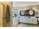 Bathroom featuring a double sink vanity, soaking tub, and wood-paneled wall at 10205 Sorrills Creek Ln, Raleigh, NC 27614
