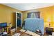 Bedroom with hardwood floors, an open closet, and a window with curtains at 10205 Sorrills Creek Ln, Raleigh, NC 27614