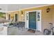 Cozy front porch featuring outdoor seating and decorative elements at 10205 Sorrills Creek Ln, Raleigh, NC 27614