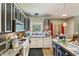 Kitchen with black and white cabinets and stainless steel appliances at 10205 Sorrills Creek Ln, Raleigh, NC 27614