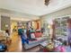 Open-concept living room with hardwood floors and backyard views at 10205 Sorrills Creek Ln, Raleigh, NC 27614