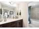 Bathroom with tub, vanity, framed mirror, and modern fixtures at 1021 Dillon Lake Dr, Knightdale, NC 27545