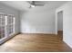 Empty dining room with wood floors, white walls, and a ceiling fan at 105 Crosswaite Way, Cary, NC 27518