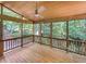 Enjoy the nature view from this screen porch with a ceiling fan and wood floor at 105 Crosswaite Way, Cary, NC 27518