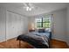 Bright bedroom with large window, hardwood floors, ample closet space, offering comfort and style at 105 Fidelity St # B19, Carrboro, NC 27510