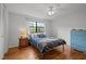Comfortable bedroom featuring natural light, hardwood floors, and essential furnishings at 105 Fidelity St # B19, Carrboro, NC 27510