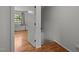 Hallway with hardwood flooring provides seamless transition between living spaces at 105 Fidelity St # B19, Carrboro, NC 27510