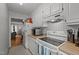 Functional kitchen featuring white cabinetry, appliances, and hardwood countertops at 105 Fidelity St # B19, Carrboro, NC 27510