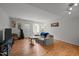 Bright living room features hardwood floors, with a comfortable couch and decorations on the walls at 105 Fidelity St # B19, Carrboro, NC 27510