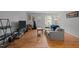 Spacious living room with hardwood floors, neutral walls, and natural light from the back door at 105 Fidelity St # B19, Carrboro, NC 27510