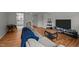 Bright living room featuring hardwood floors, a couch, decorations and an open layout at 105 Fidelity St # B19, Carrboro, NC 27510