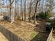 Fenced backyard with shed and plenty of tree coverage at 1195 Champion Dr, Cary, NC 27511