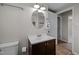 Cozy bathroom featuring updated vanity, tile flooring, and modern lighting fixtures at 1195 Champion Dr, Cary, NC 27511