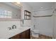 Bathroom featuring wood-look floors, modern vanity, and white subway tile in the shower and tub at 1195 Champion Dr, Cary, NC 27511