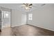 Bedroom with vinyl plank flooring, natural light, and easy access to stairs at 1195 Champion Dr, Cary, NC 27511