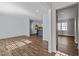 Bright, open living space with hardwood flooring offers seamless access to the kitchen, enhancing the home's flow at 1195 Champion Dr, Cary, NC 27511