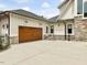 Exterior view of the home's side entry garage with stone accents at 121 Anfield Rd, New Hill, NC 27562