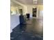 View of interior with a sink, cabinets, reflective exit sign, and doors along the back at 1403 S Roxboro Street, Durham, NC 27703