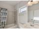 Well-lit bathroom featuring shower over tub with tile surround, and sleek vanity with mirror at 1475 Sierra Glen Cir, Apex, NC 27502