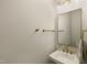 Modern powder room features a sleek vanity, gold fixtures, and a minimalist design for a clean and elegant look at 1475 Sierra Glen Cir, Apex, NC 27502