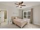 Bright bedroom with ample light and cozy furnishings complemented by a connected bathroom at 1475 Sierra Glen Cir, Apex, NC 27502