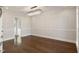 Open-concept dining area featuring hardwood floors, elegant lighting, and a seamless flow into the rest of the home's living spaces at 1475 Sierra Glen Cir, Apex, NC 27502