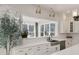 The kitchen features stainless steel appliances, a view of the backyard, and recessed lighting at 1475 Sierra Glen Cir, Apex, NC 27502