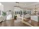 View of the kitchen featuring an open floor plan and a modern design with light-colored finishes and hardwood floors at 1475 Sierra Glen Cir, Apex, NC 27502
