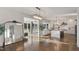 View of the kitchen featuring an open floor plan and a modern design with light-colored finishes and hardwood floors at 1475 Sierra Glen Cir, Apex, NC 27502