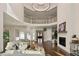 The expansive living area features an open floor plan and hardwood floors, perfect for gatherings at 1475 Sierra Glen Cir, Apex, NC 27502