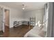 Spacious living room with hardwood floors, large window, and comfortable seating area at 1475 Sierra Glen Cir, Apex, NC 27502