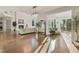 Open-concept living room with hardwood floors, fireplace, and abundant natural light at 1475 Sierra Glen Cir, Apex, NC 27502