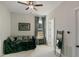 Relaxing living room area features a comfortable daybed, large mirror, and soft natural light at 1475 Sierra Glen Cir, Apex, NC 27502