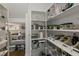 Walk-in pantry with white shelves providing ample storage space for food and supplies at 1475 Sierra Glen Cir, Apex, NC 27502