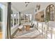 Bright sunroom features a dining table and bench seating, plus a view of the deck at 1475 Sierra Glen Cir, Apex, NC 27502