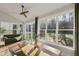 Sunroom with deck access, dining table, and large windows offering natural light at 1475 Sierra Glen Cir, Apex, NC 27502