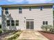 This house has a patio and backyard space with plenty of windows providing natural light at 148 Daneborg Rd, Durham, NC 27703