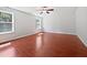 This bedroom has cherry wood floors and multiple windows for natural lighting at 148 Daneborg Rd, Durham, NC 27703
