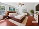 This bedroom boasts a ceiling fan, a warm rug, and is virtually staged to show its potential at 148 Daneborg Rd, Durham, NC 27703
