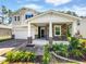 Charming home with stone accents, covered front porch, and beautifully landscaped front yard at 148 Daneborg Rd, Durham, NC 27703