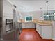 This kitchen has stainless steel appliances, light countertops and white cabinets at 148 Daneborg Rd, Durham, NC 27703