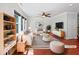 Bright living room boasts stylish decor, comfortable seating, and a ceiling fan for added comfort at 148 Daneborg Rd, Durham, NC 27703