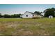 Expansive backyard featuring a newly constructed deck, shed, and privacy provided by mature trees at 1602 Fairground Rd, Dunn, NC 28334